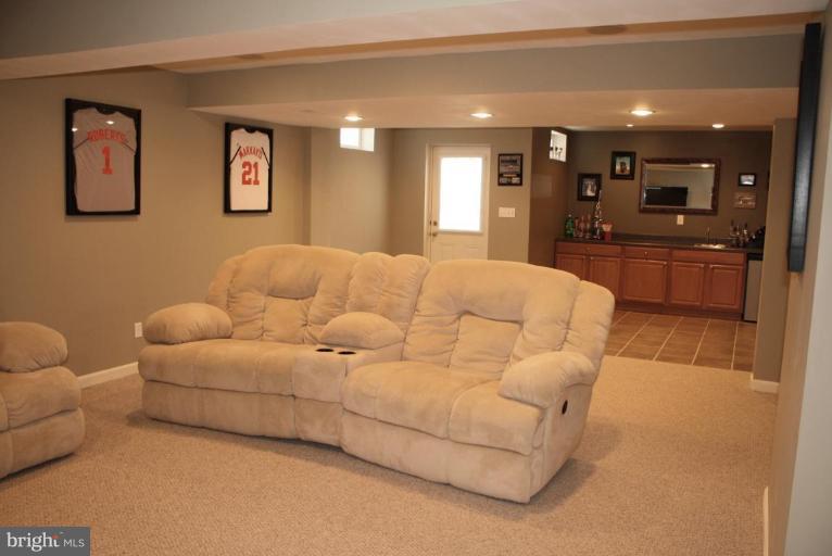 5627 New Forge Road White Marsh, MD 21162 - Photo 30 of 30 a living room with furniture and a view of kitchen