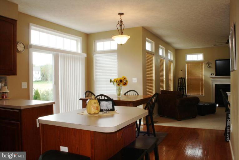 5627 New Forge Road White Marsh, MD 21162 - Photo 6 of 30 a view of a dining room with furniture and a chandelier