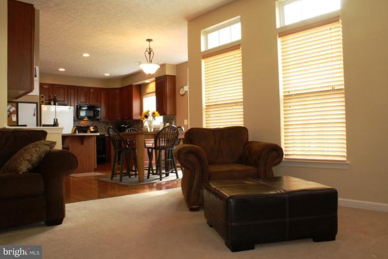 5627 New Forge Road White Marsh, MD 21162 - Photo 8 of 30 a living room with furniture and a large window