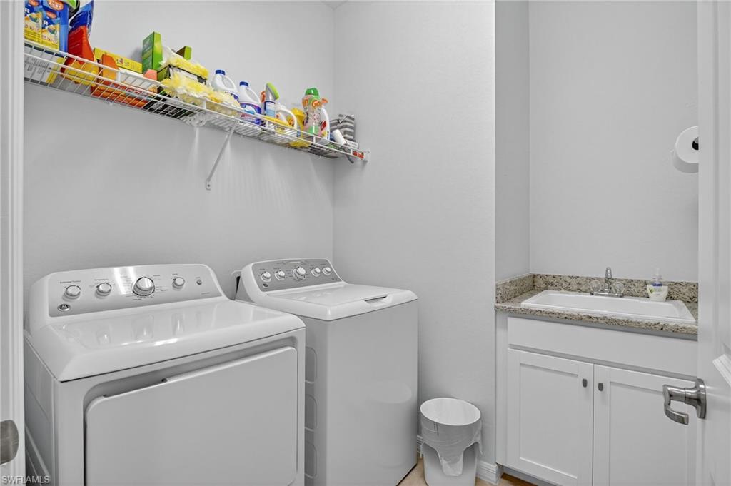 2130 Hamlin Street Naples, FL 34120 - Photo 27 of 43 a utility room with dryer and washer