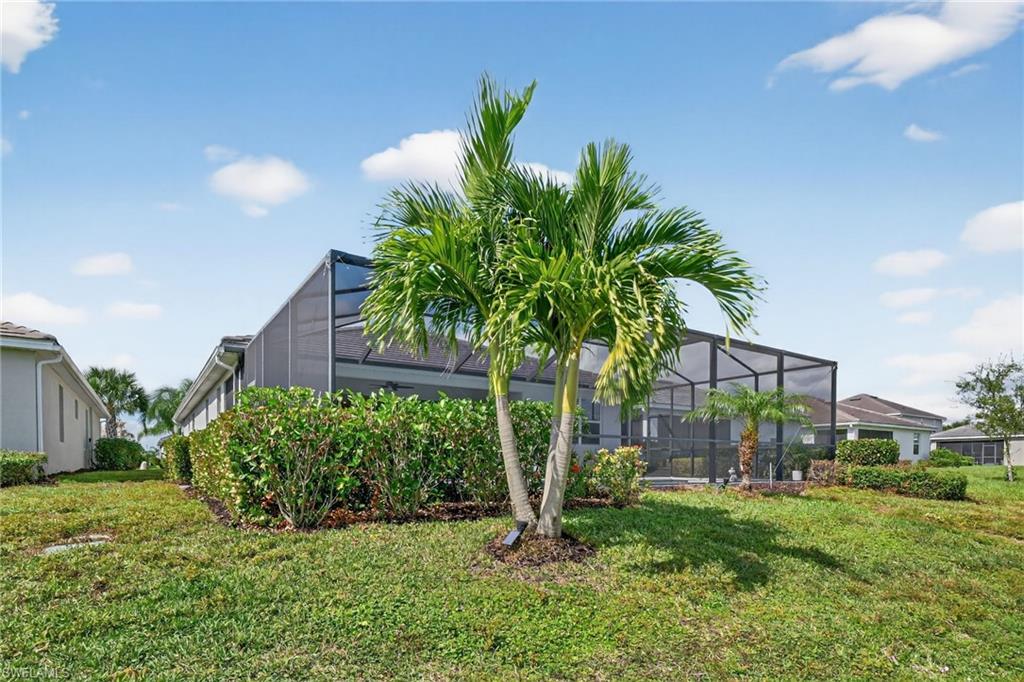 2130 Hamlin Street Naples, FL 34120 - Photo 30 of 43 a house with a tree in front of it