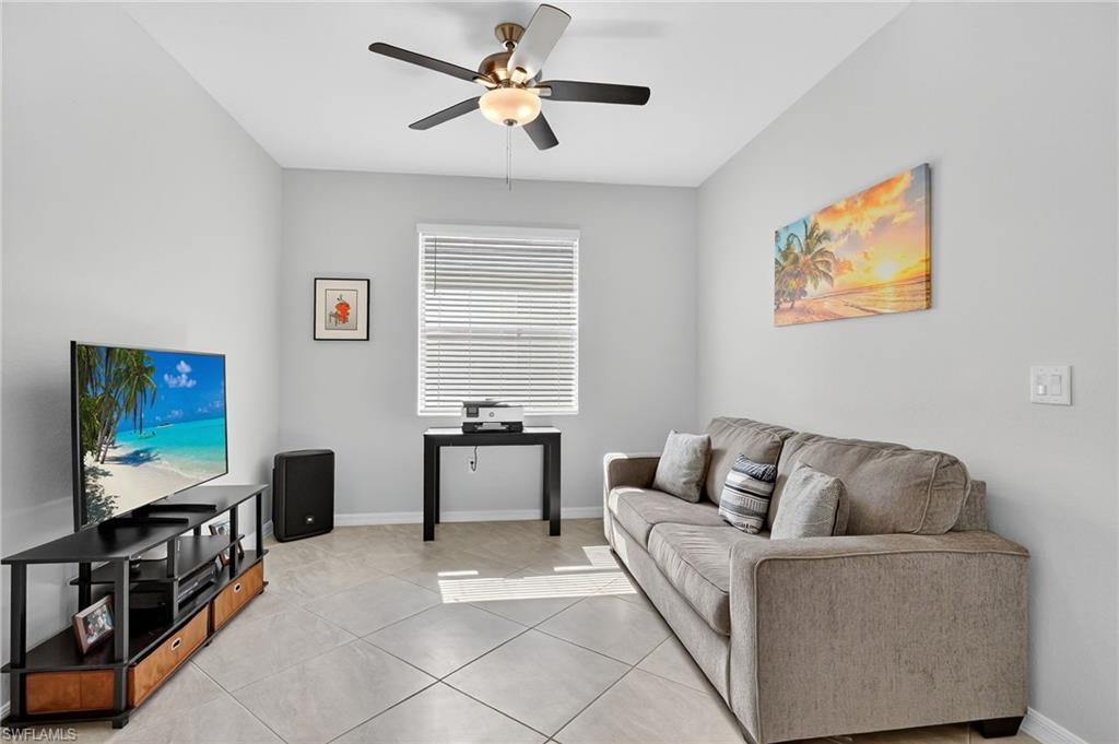 2130 Hamlin Street Naples, FL 34120 - Photo 6 of 43 a living room with furniture and a flat screen tv