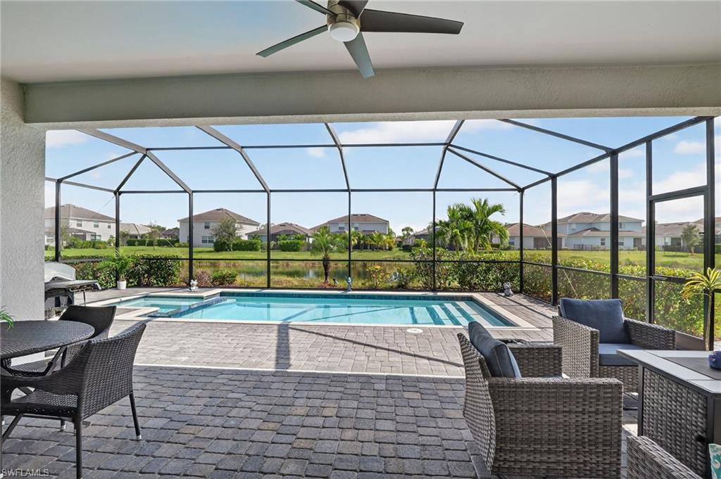 2130 Hamlin Street Naples, FL 34120 - Photo 10 of 43 a view of a swimming pool with a porch