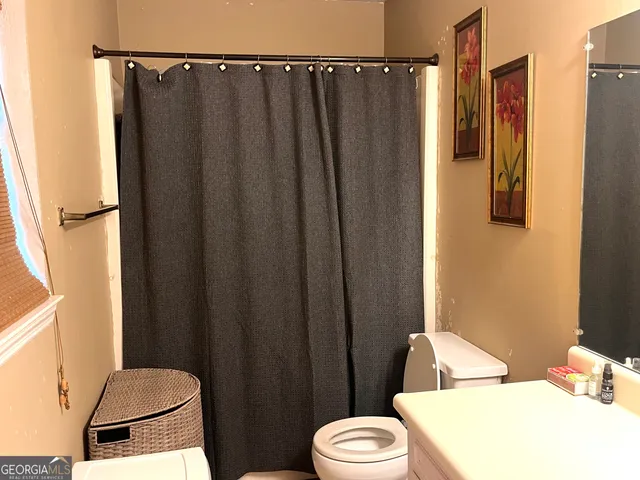 a bathroom with a sink and toilet