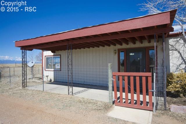 17135 Finch Road Colorado Springs, CO 80928 - Photo 24 of 36 Covered patio on secondary home!