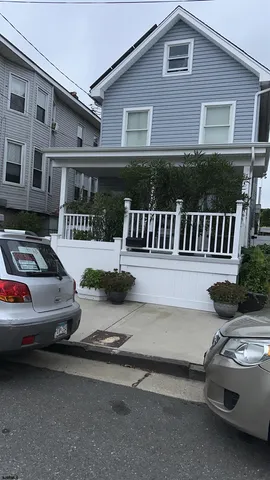 a view of a car park in front of house