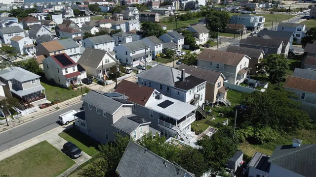 an aerial view of residential house with outdoor space