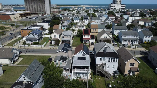 an aerial view of a residential apartment building with a yard
