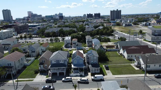 a picture of houses with outdoor space and lake view