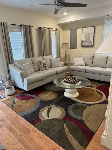 a living room with furniture and a rug