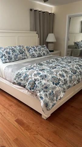 a bedroom with a bed and a dresser