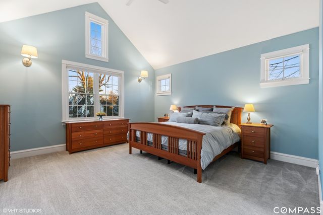 a bed sitting in a room with a window