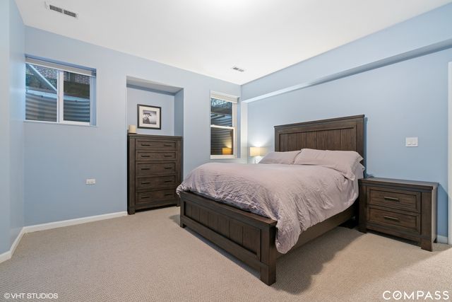 a bedroom with a bed and dresser