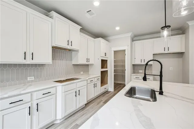 a bathroom with a sink a toilet and a bathtub