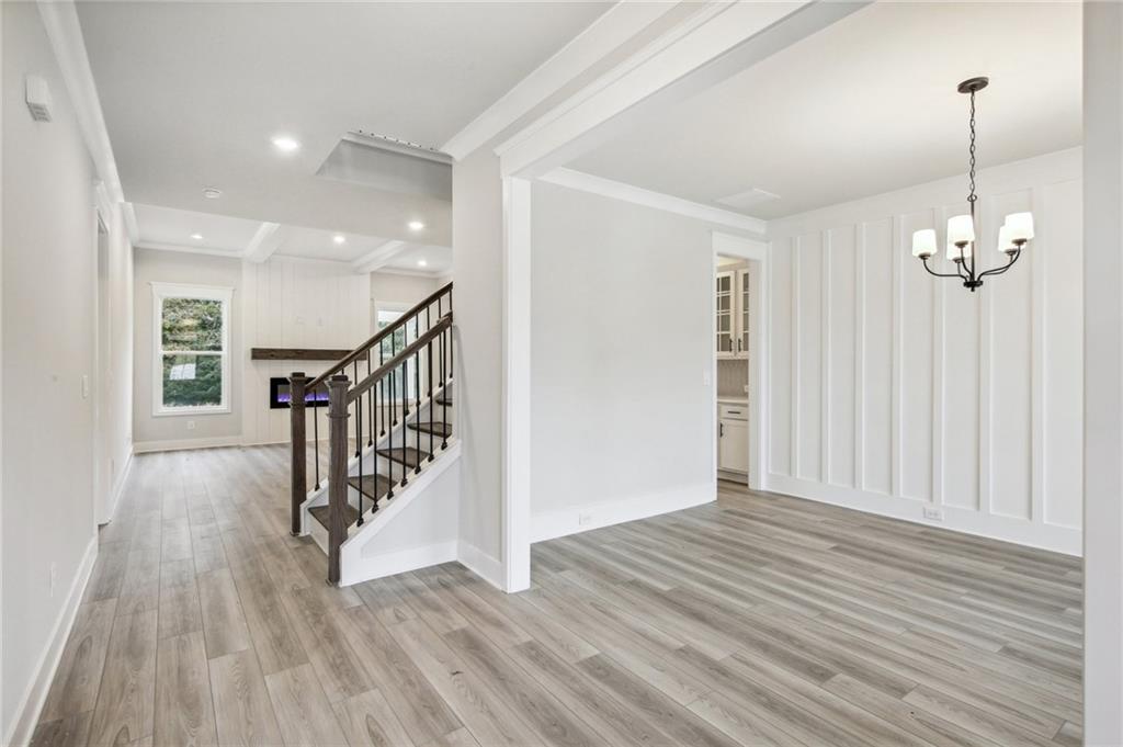 368 Scarlet Rose Way Hoschton, GA 30548 - Photo 20 of 150 a view of a room with wooden floor and stairs