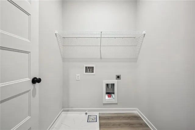 a front view of a house with a yard table and chairs