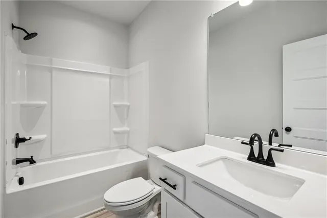 a view of a chairs and table in front of house