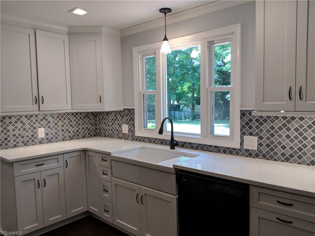 550 Pepperidge Road Lewisville, NC 27023 - Photo 12 of 30 These custom cabinets with soft closures have every design imaginable to maximize space and storage. Knockout window design and LARGE farmhouse apron sink, LOVE!