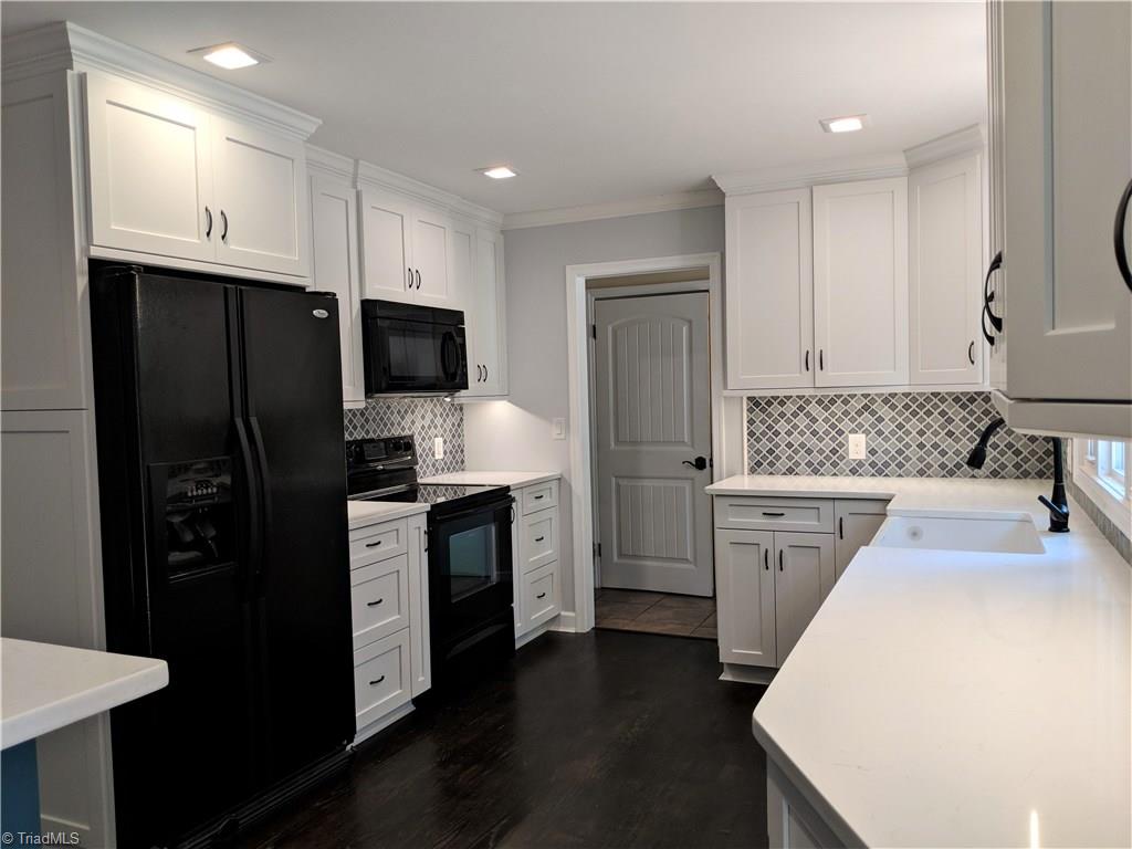 550 Pepperidge Road Lewisville, NC 27023 - Photo 13 of 30 Quartz counter tops, custom cabinet storage and plenty of it. Recessed can lights throughout kitchen/dining area.