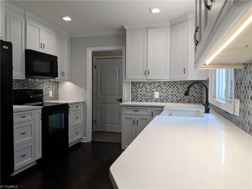 550 Pepperidge Road Lewisville, NC 27023 - Photo 14 of 30 LED under cabinet lighting too. Graphic backsplash completes the punch to make this kitchen shine!