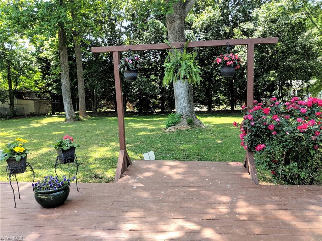 550 Pepperidge Road Lewisville, NC 27023 - Photo 25 of 30 Wowser of a backyard, mature trees, landscaping, AND fenced-in.