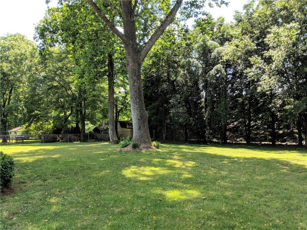 550 Pepperidge Road Lewisville, NC 27023 - Photo 28 of 30 Lots of shade & room to play in this fabulous backyard.