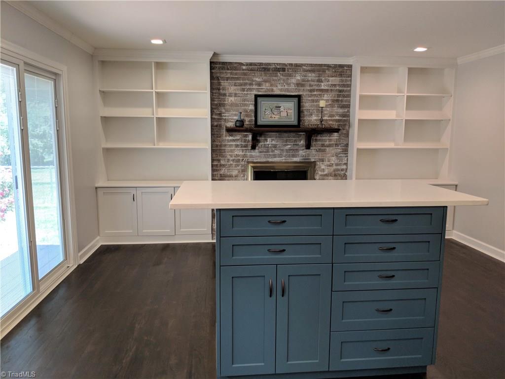 550 Pepperidge Road Lewisville, NC 27023 - Photo 10 of 30 Kitchen island has great storage and a 3 sided spacious eat-at counter top with plenty of room to spread out, plus USB ports.