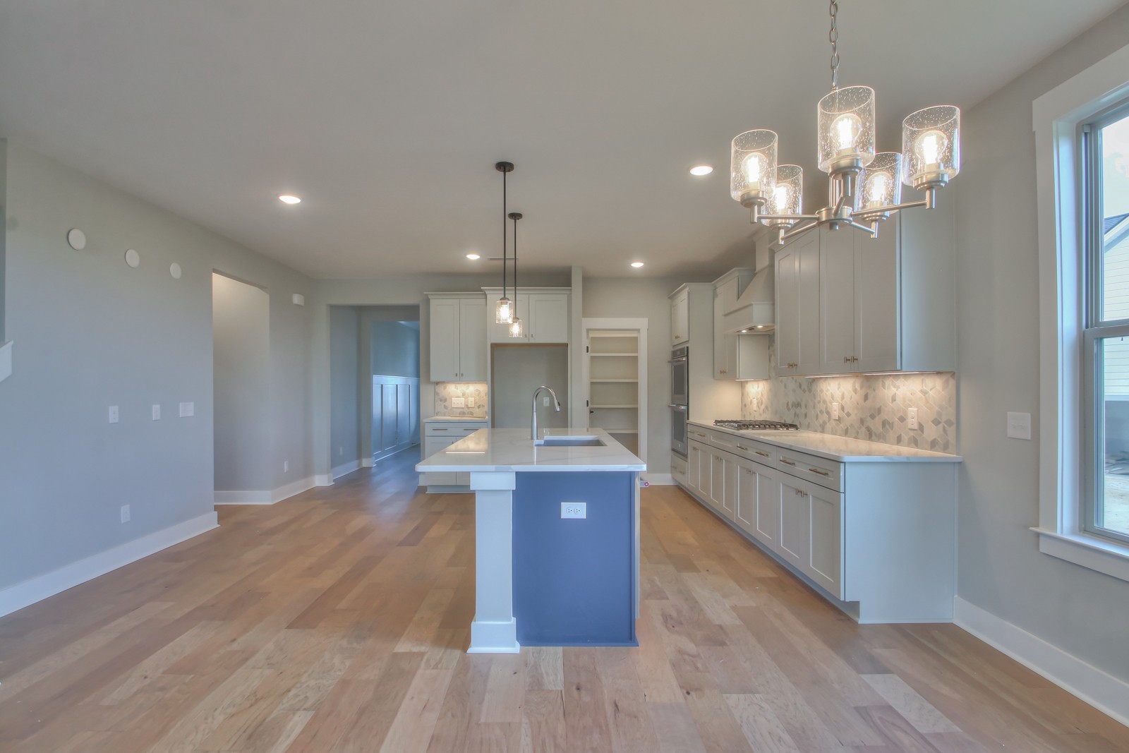 184 Phillips Bend Spring Hill Spring Hill, TN 37174 - Photo 11 of 39 a large kitchen with granite countertop a large island in the center and stainless steel appliances