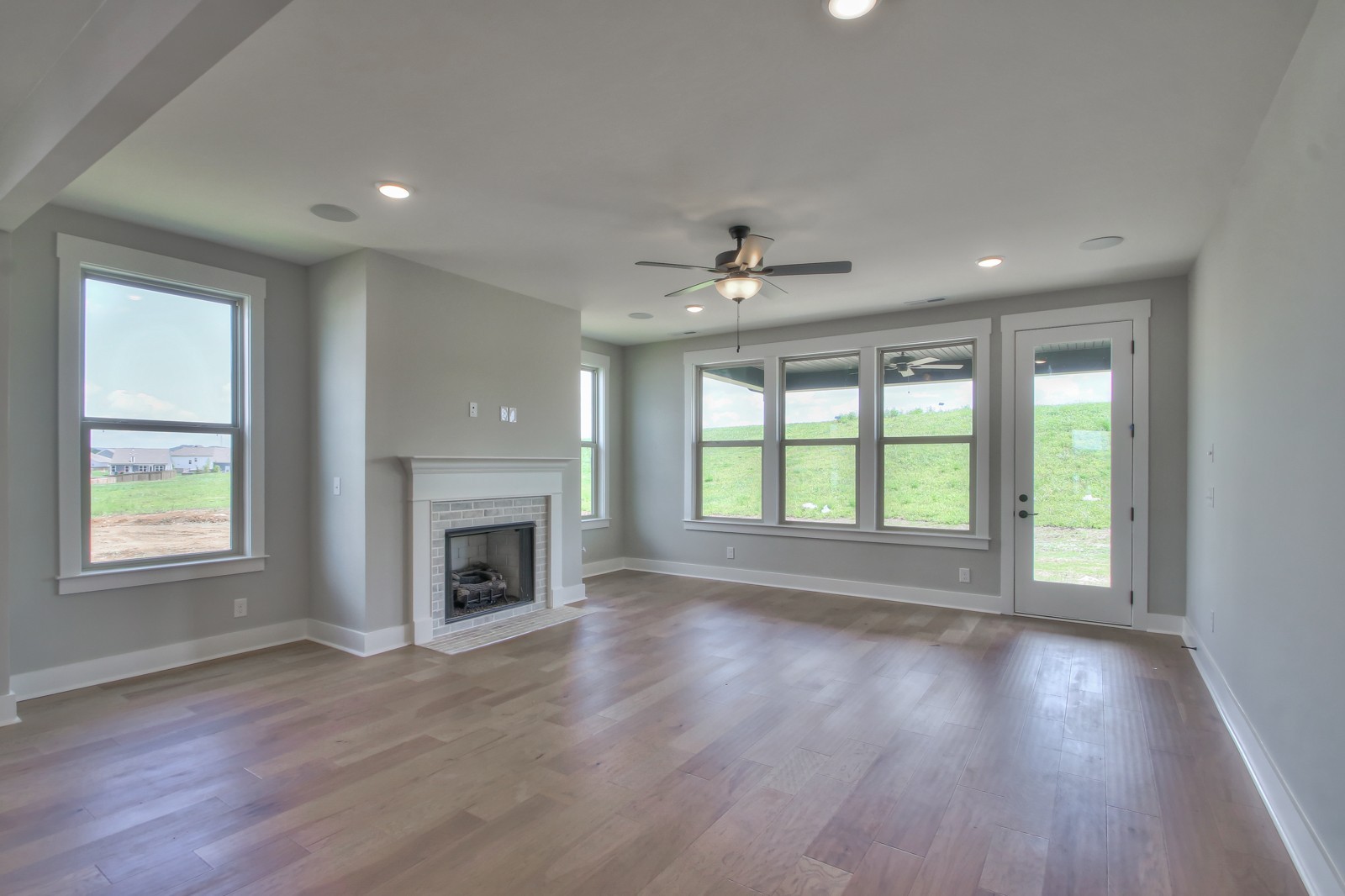 184 Phillips Bend Spring Hill Spring Hill, TN 37174 - Photo 12 of 39 a view of an empty room with a window and wooden floor