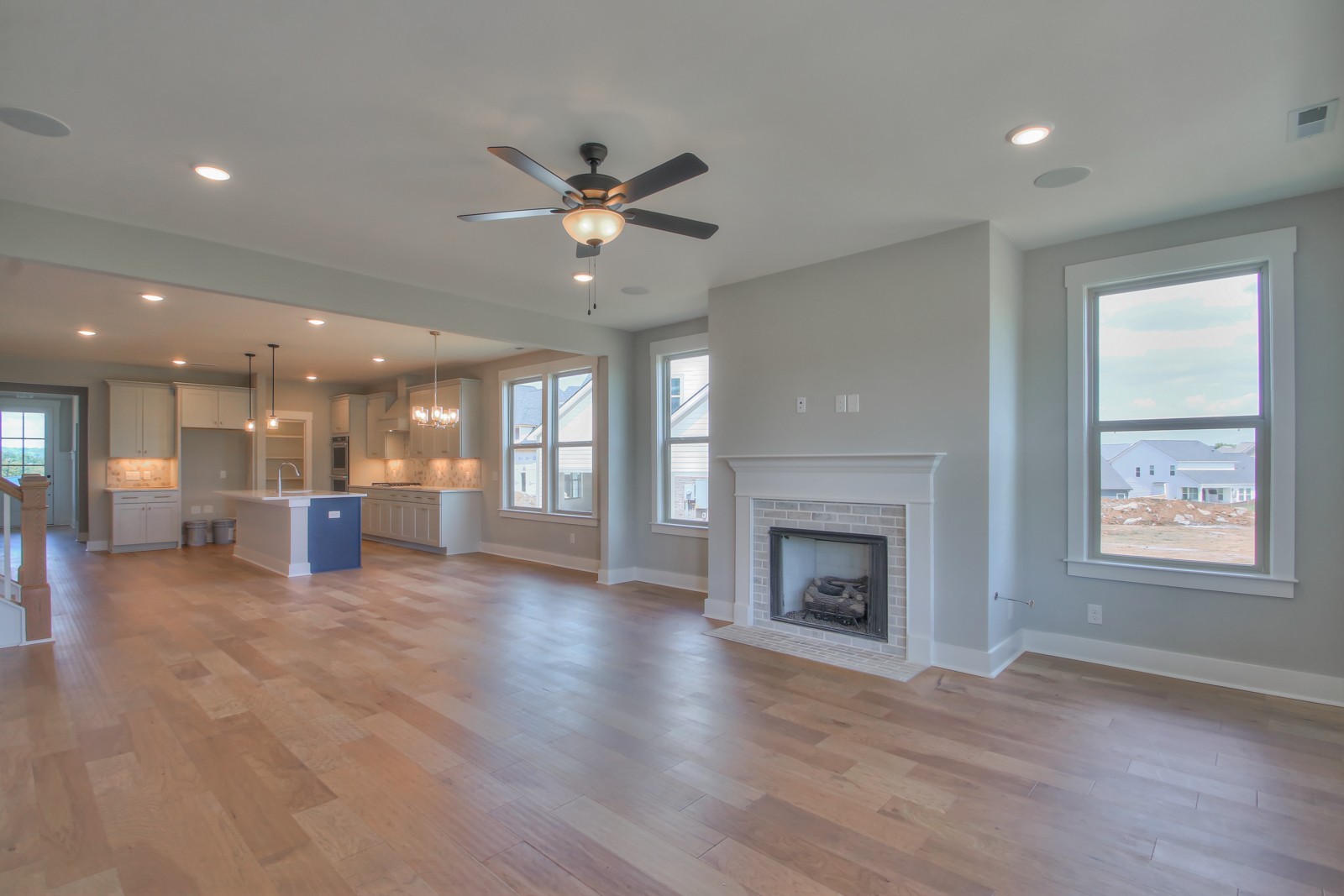 184 Phillips Bend Spring Hill Spring Hill, TN 37174 - Photo 13 of 39 an empty room with wooden floor fireplace and windows