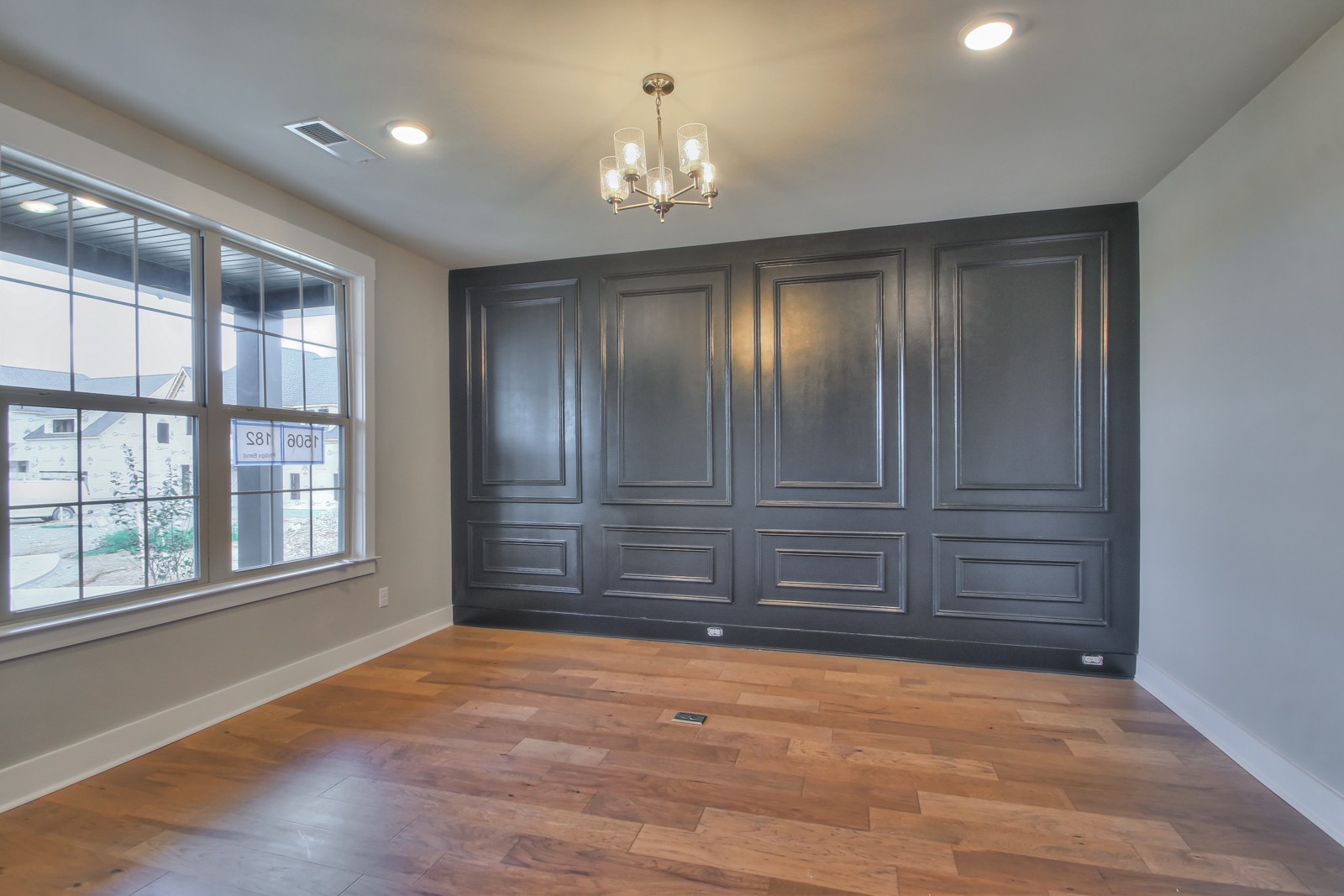 184 Phillips Bend Spring Hill Spring Hill, TN 37174 - Photo 6 of 39 an empty room with wooden floor cabinet and windows