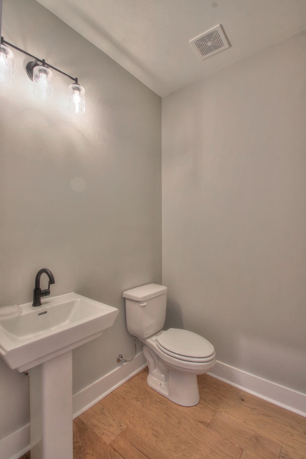 184 Phillips Bend Spring Hill Spring Hill, TN 37174 - Photo 7 of 39 a white toilet sitting next to a bathroom sink