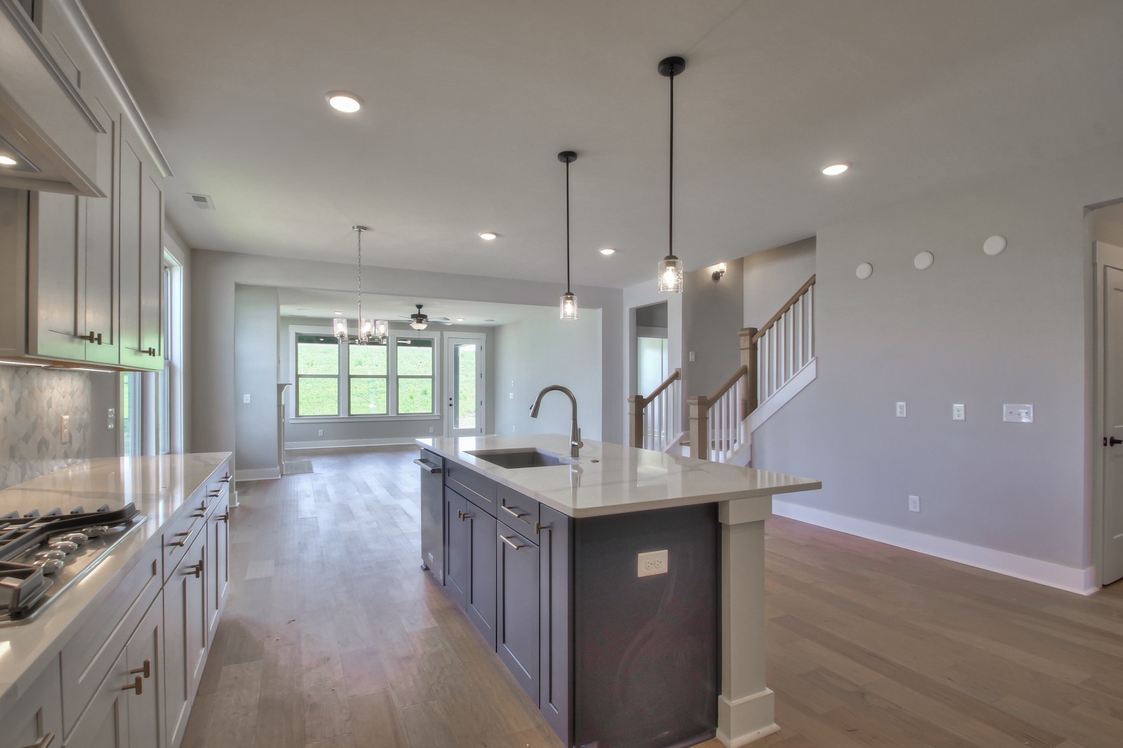 184 Phillips Bend Spring Hill Spring Hill, TN 37174 - Photo 10 of 39 a kitchen with stainless steel appliances granite countertop a stove a sink a refrigerator and a wooden floor