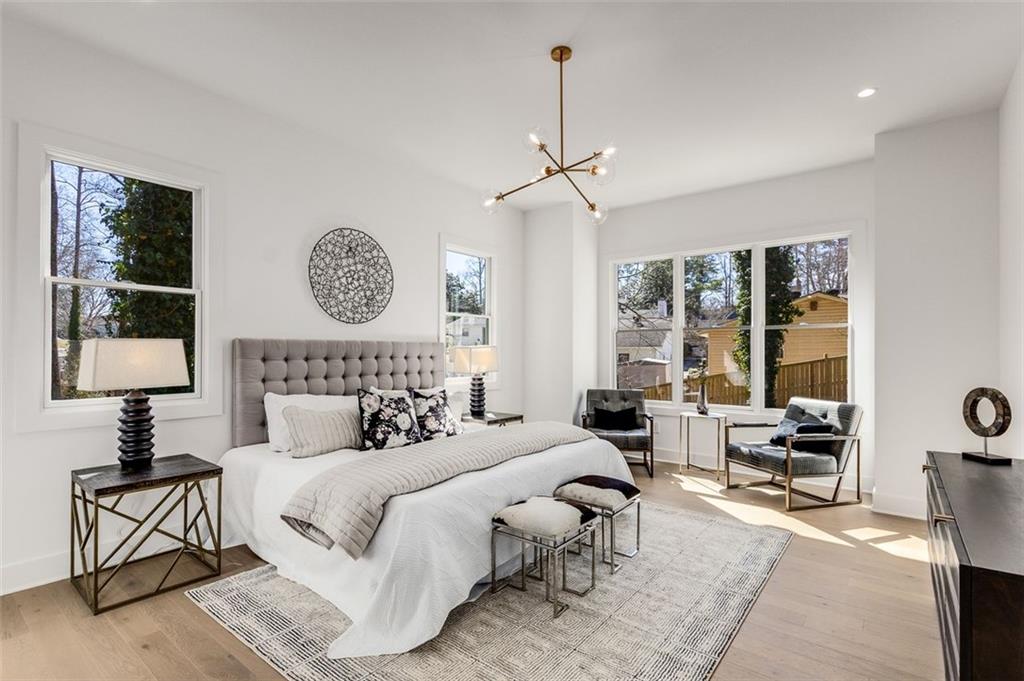 224 Pindos Place Southwest Powder Springs, GA 30127 - Photo 5 of 9 a bedroom with furniture and a large window