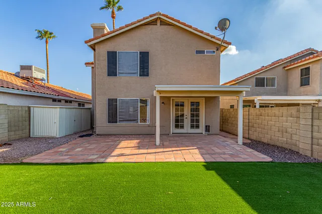 a front view of a house with glass windows