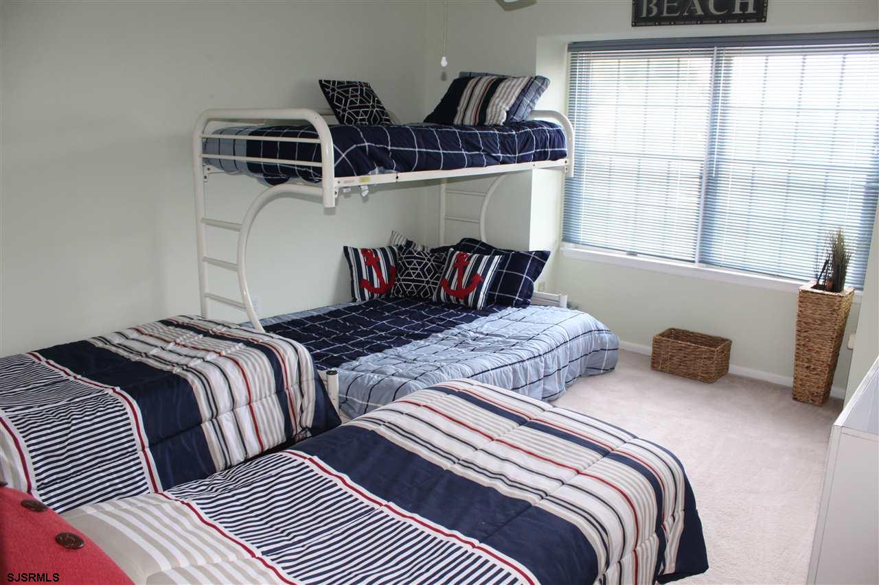 1101 East Shore Drive, Unit C Brigantine, NJ 08203 - Photo 15 of 22 a bedroom with two beds and a window