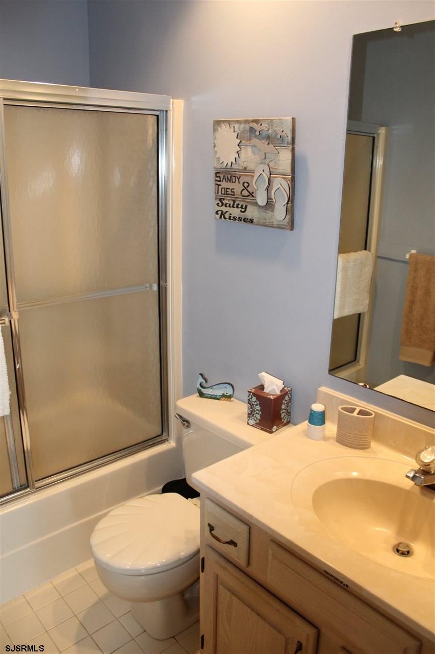 1101 East Shore Drive, Unit C Brigantine, NJ 08203 - Photo 20 of 22 a bathroom with a sink and a mirror