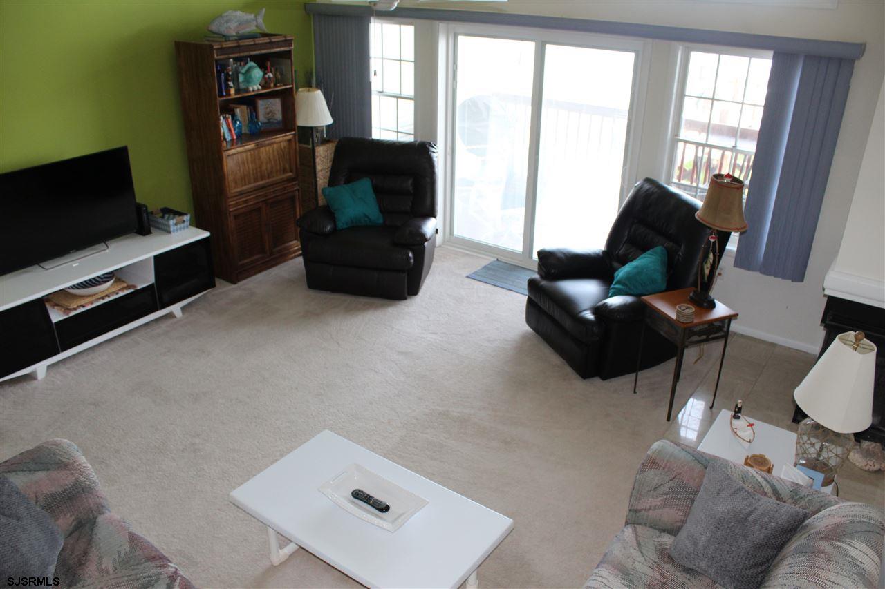 1101 East Shore Drive, Unit C Brigantine, NJ 08203 - Photo 3 of 22 a living room with furniture and a flat screen tv