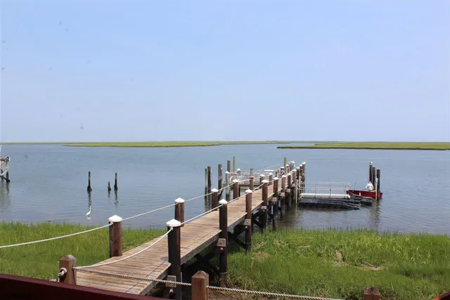 a view of a swimming pool with an outdoor seating