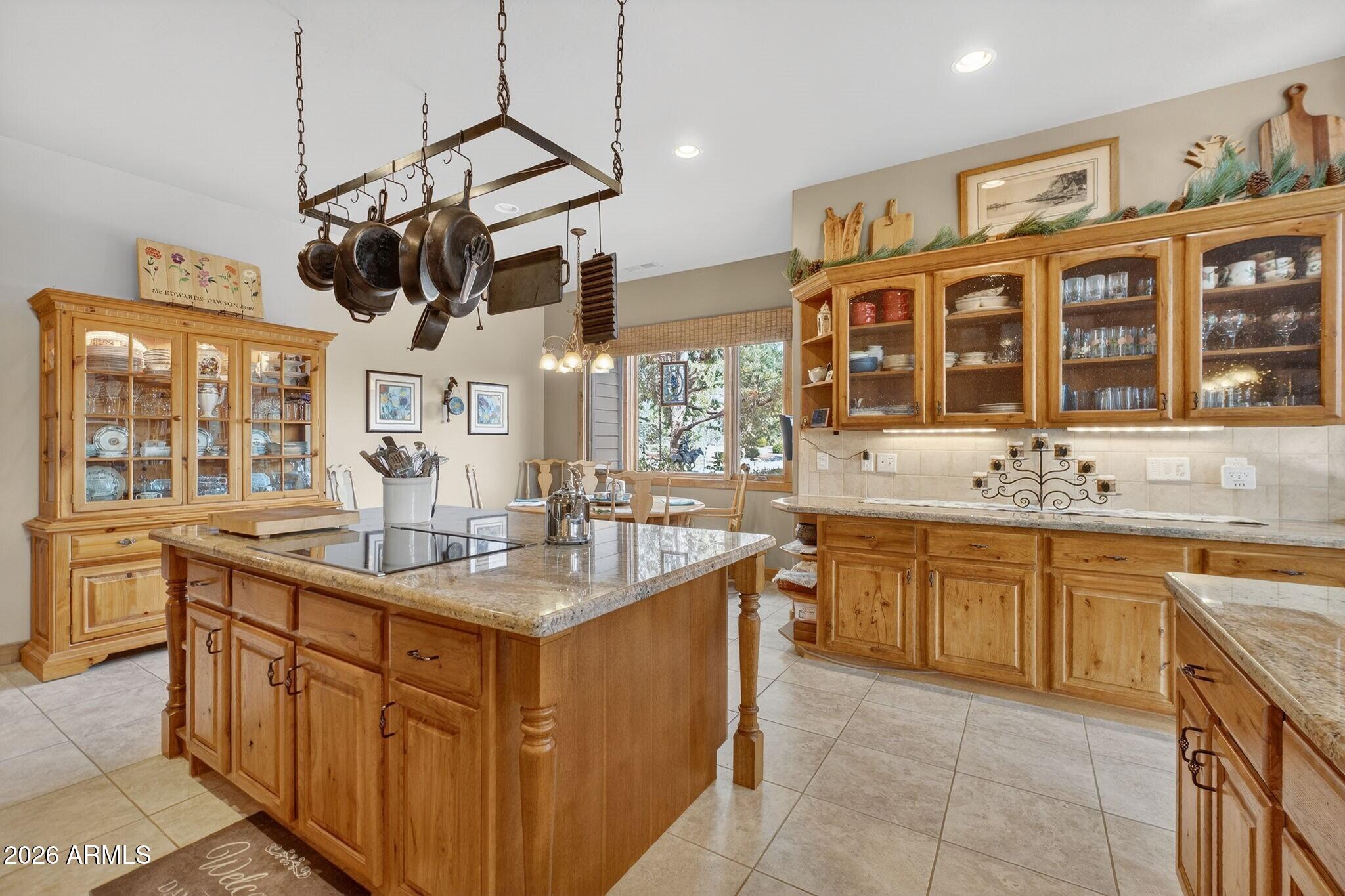 9820 Clear Fork Road Prescott, AZ 86305 - Photo 13 of 75 a kitchen with stainless steel appliances granite countertop a sink and a stove