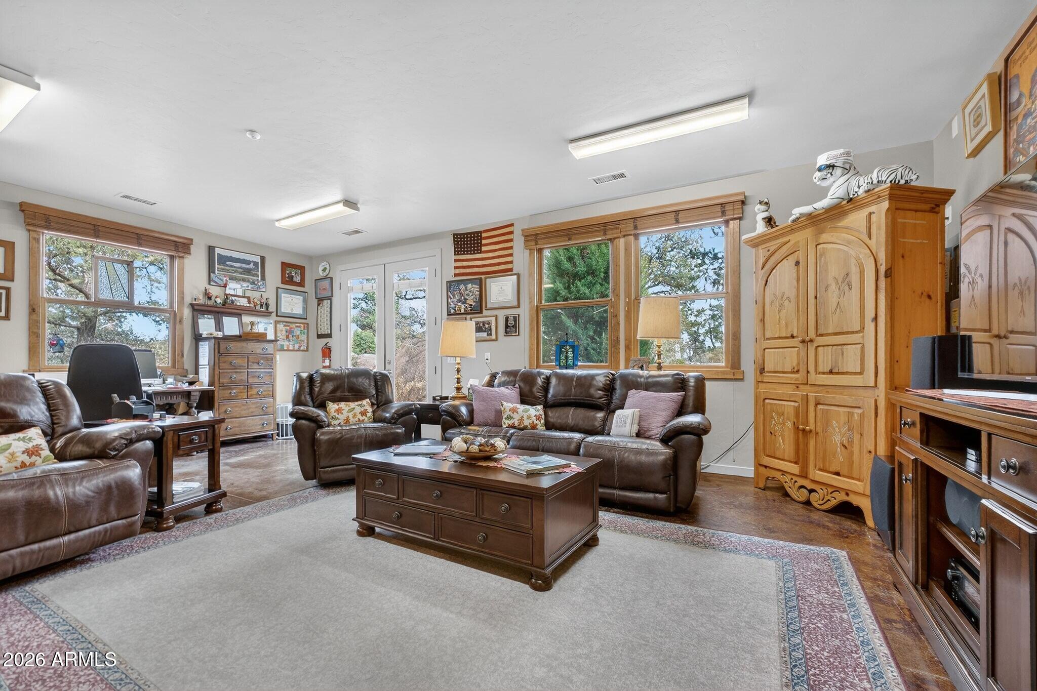 9820 Clear Fork Road Prescott, AZ 86305 - Photo 20 of 75 a living room with furniture fireplace and a large window