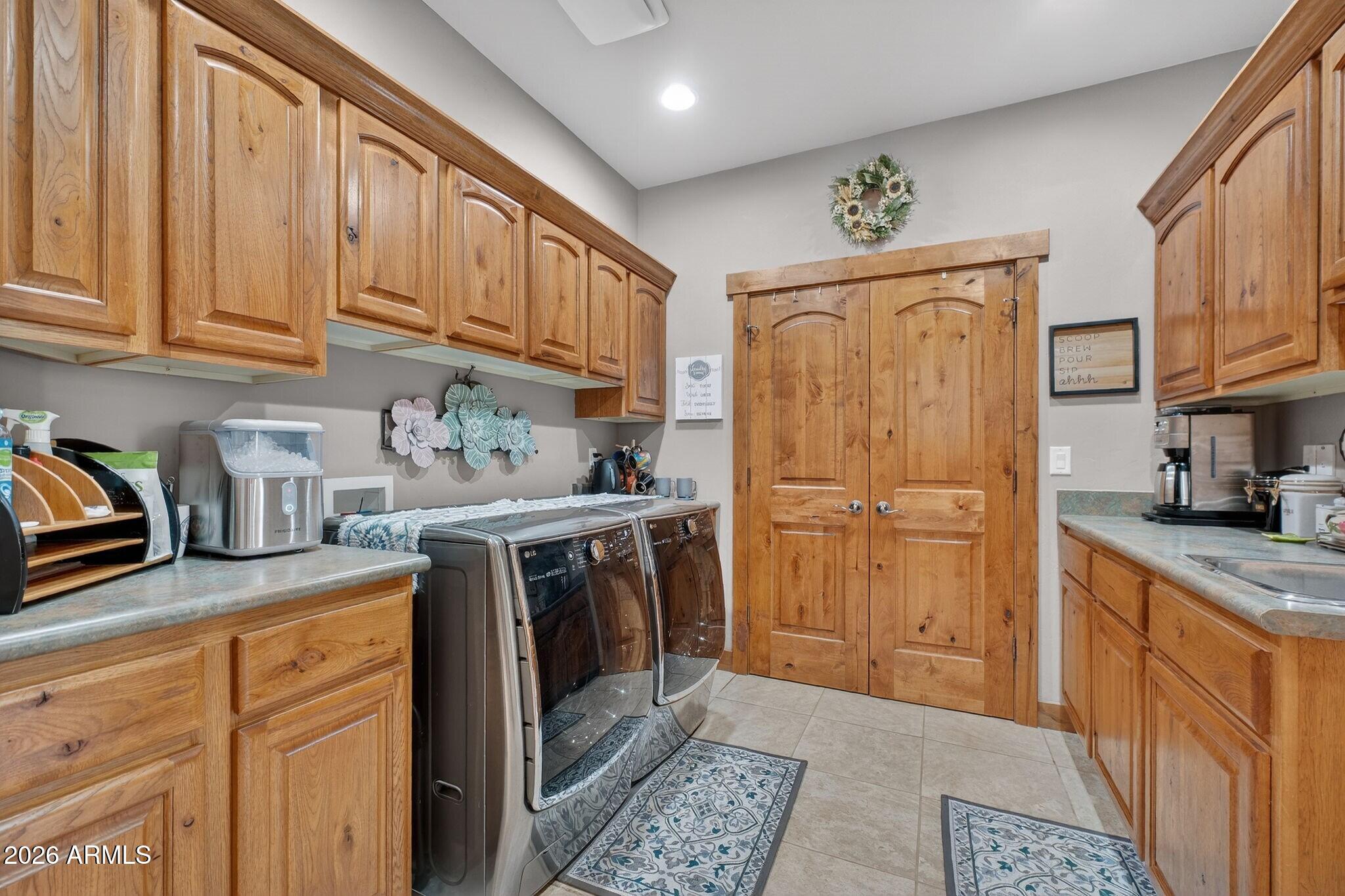 9820 Clear Fork Road Prescott, AZ 86305 - Photo 22 of 75 a kitchen with stainless steel appliances granite countertop a refrigerator sink and cabinets