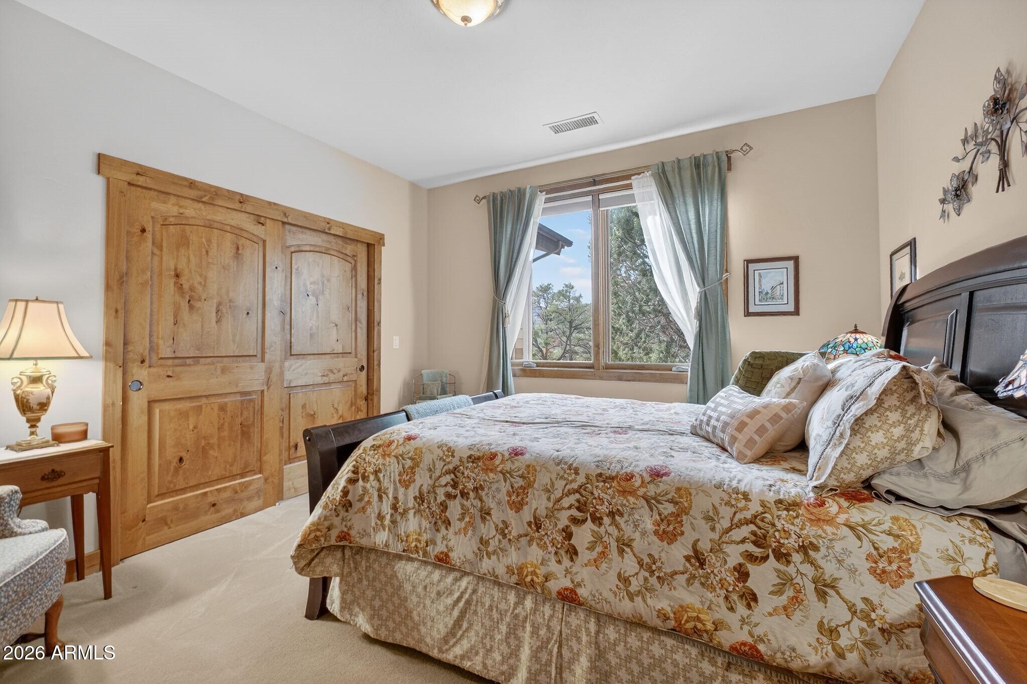 9820 Clear Fork Road Prescott, AZ 86305 - Photo 23 of 75 a bedroom with a bed and a window