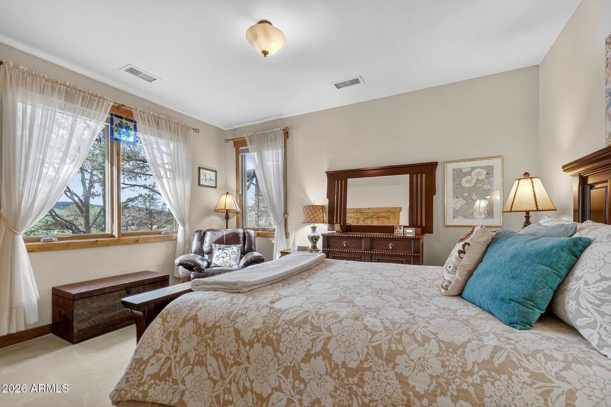 9820 Clear Fork Road Prescott, AZ 86305 - Photo 27 of 75 a spacious bedroom with a bed and a large window