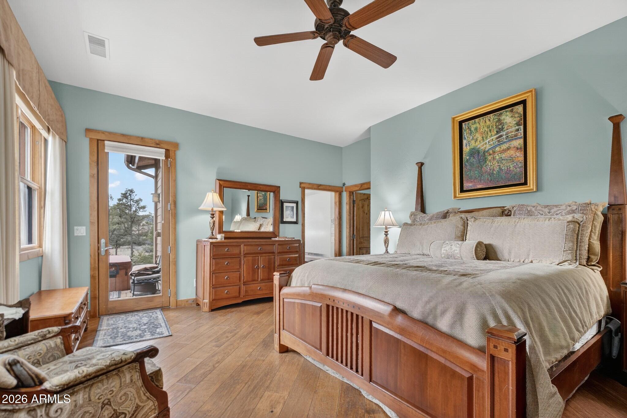 9820 Clear Fork Road Prescott, AZ 86305 - Photo 28 of 75 a bedroom with a bed and wooden floor