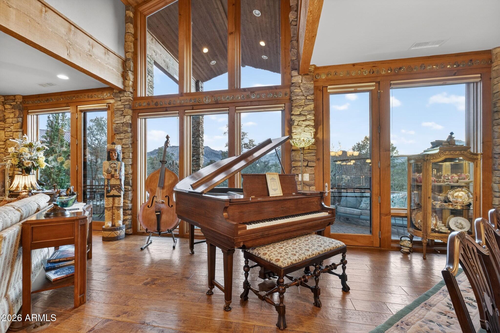 9820 Clear Fork Road Prescott, AZ 86305 - Photo 8 of 75 a living room with furniture a wooden floor and a large window