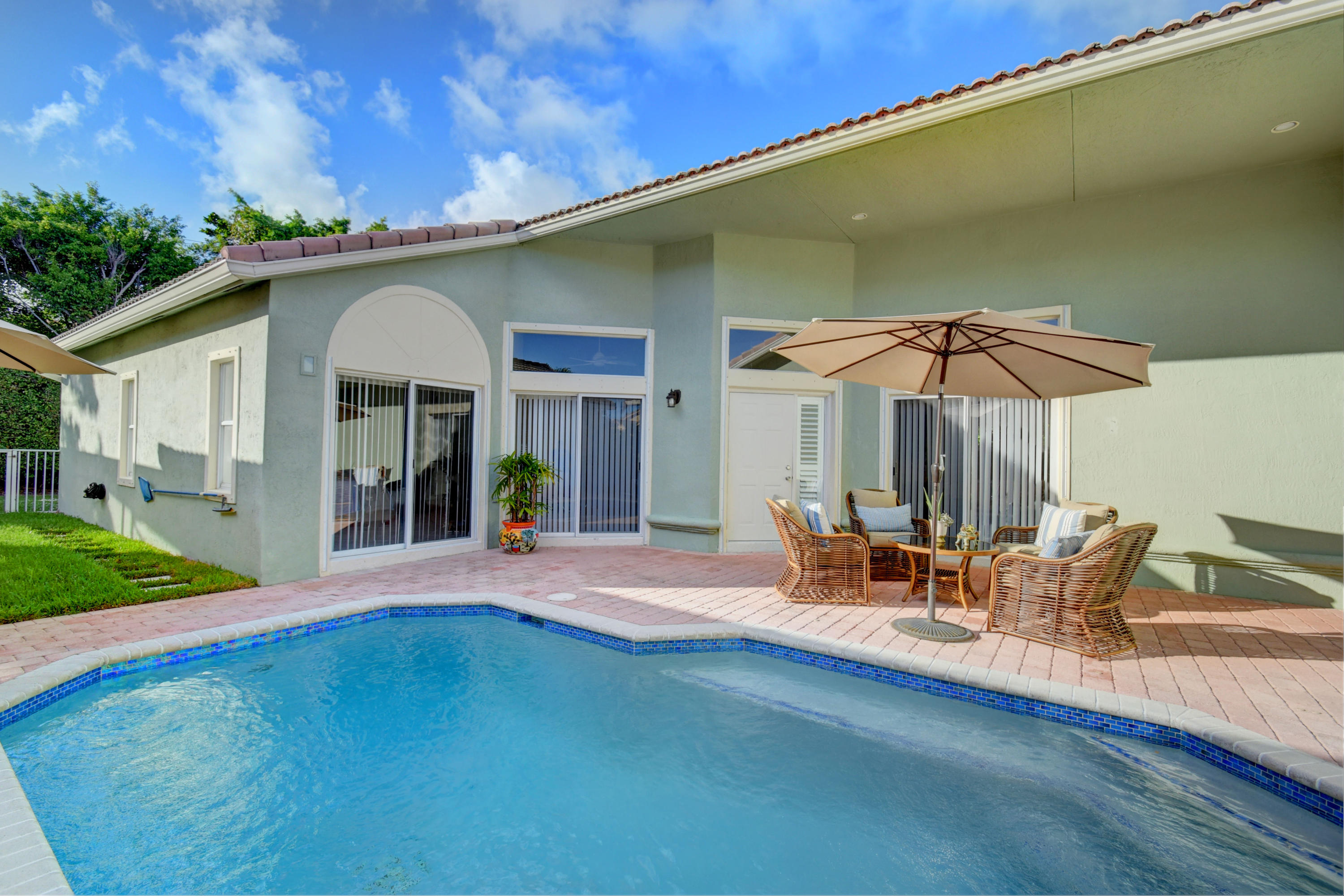 7201 Northwest Turtle Walk Boca Raton, FL 33487 - Photo 1 of 39 Inviting Courtyard Pool Home