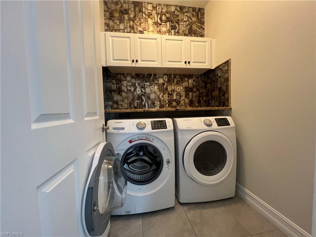 28442 Captiva Shell Loop Bonita Springs, FL 34135 - Photo 20 of 35 a utility room with dryer and washer