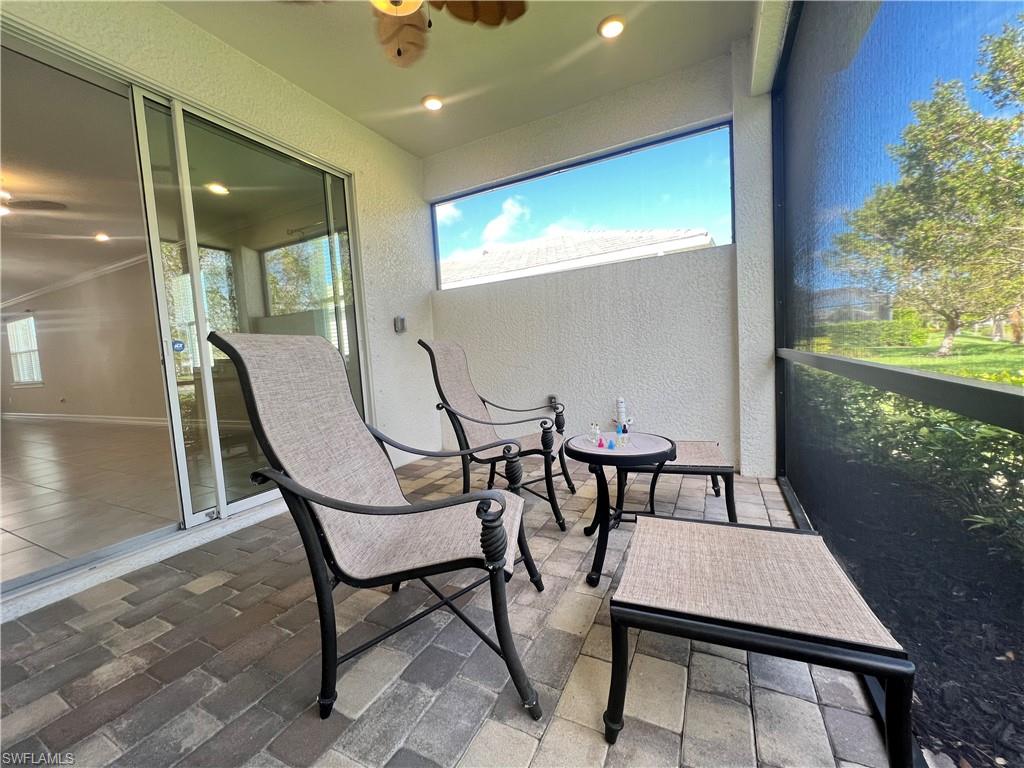 28442 Captiva Shell Loop Bonita Springs, FL 34135 - Photo 23 of 35 a view of a dining room with furniture and a window