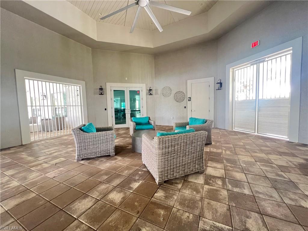 28442 Captiva Shell Loop Bonita Springs, FL 34135 - Photo 28 of 35 a living room with furniture and wooden floor